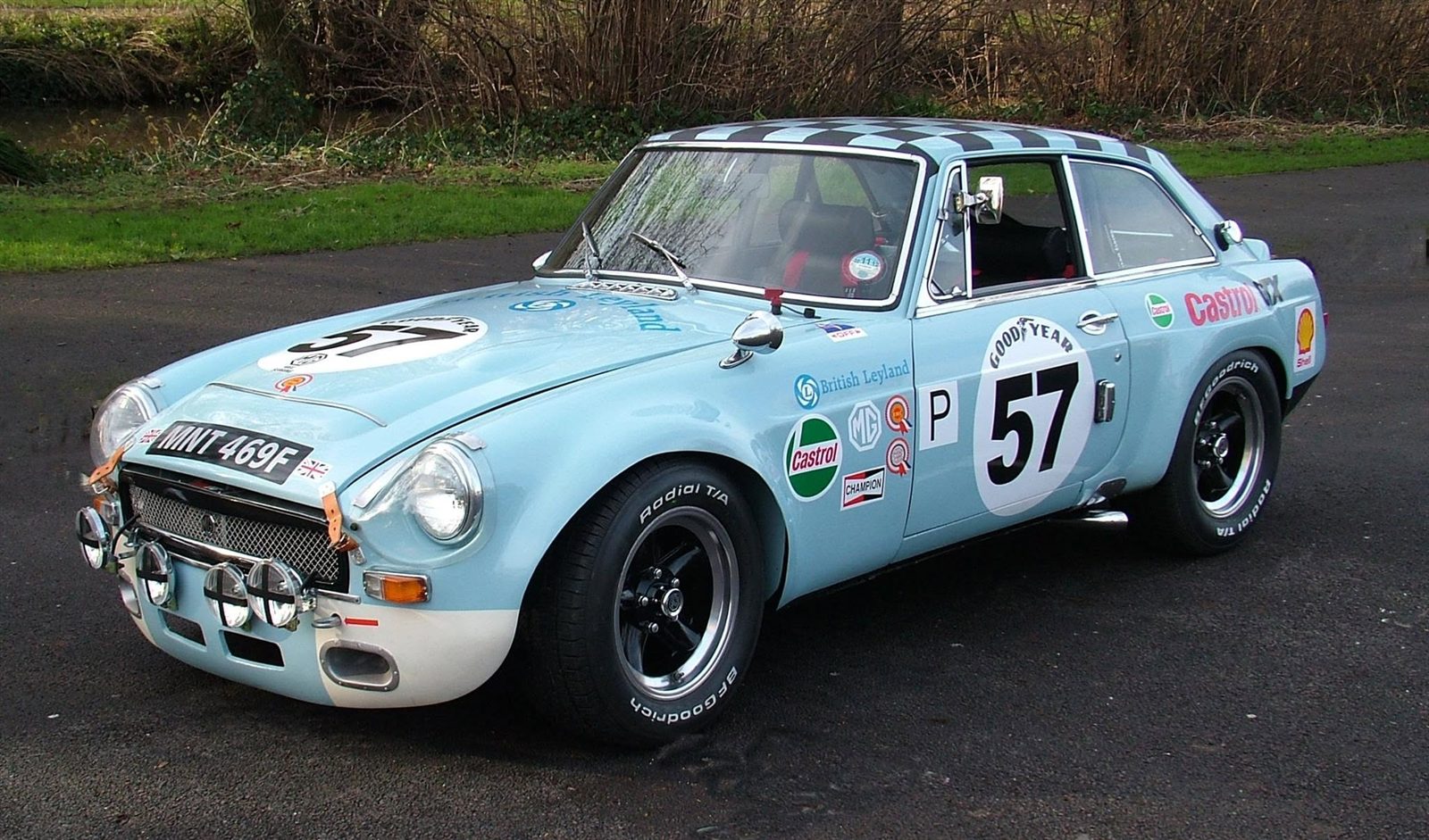 Light blue MGB GT in race livery, number 57